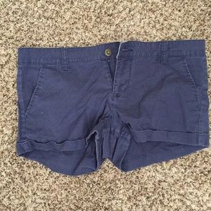Navy blue shorts.